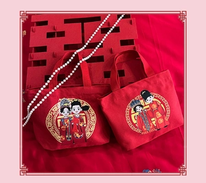 Detail of red wedding canvas tote bags with traditional Chinese cartoon couple illustration