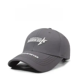 Detailed close-up of dark grey cotton baseball cap with white Never Say Never embroidery