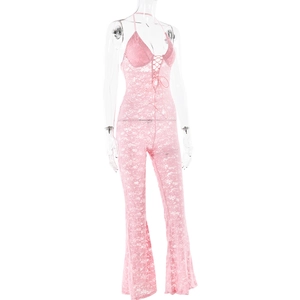 Macro detail of pink lace jumpsuit featuring halter neck and front tie drawstring closure