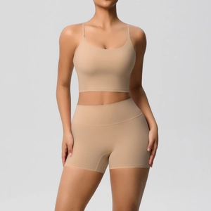 Front view of seamless high-stretch two-piece yoga set in light khaki bra and shorts