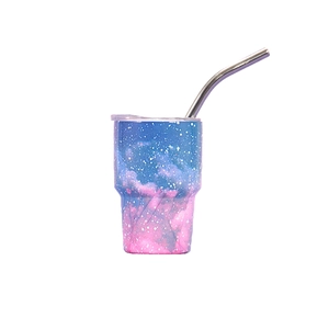 Detail of 3oz mini tumbler featuring vibrant nebula pattern and silver metal straw