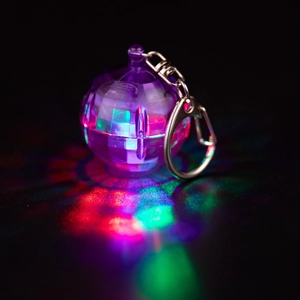 Purple LED disco ball keychain with colorful light projection and metal ring