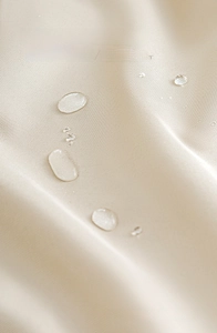 Macro shot of water-repellent and oil-proof twill fabric texture in cream beige