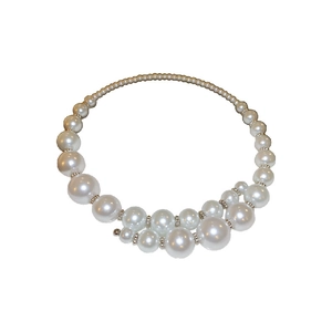 Elegant irregular pearl necklace with crystal spacers for women on white background