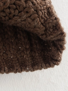 Deep brown chunky knit sweater vest featuring premium thick yarn and rich texture