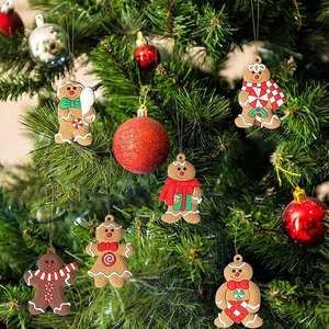 Classic gingerbread man ornaments hanging on a Christmas tree for festive decoration