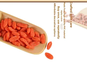 Close-up of realistic PVC wolfberry model displayed in a bamboo spoon for food photography