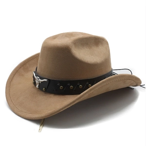 Detail of silver bull head buckle on a khaki western cowboy hat with black leather band