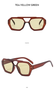Detail view showing retro hexagon tea-colored frame and double bridge pilot sunglasses