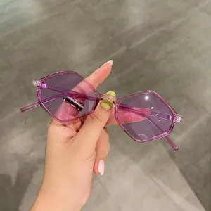 Modern purple hexagonal geometric sunglasses featuring translucent frames and tinted lenses