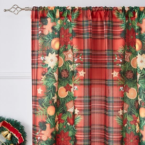 Close-up of Christmas red plaid curtains featuring gingerbread man and holly prints