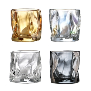Ins style twisted origami whiskey glasses in gold, iridescent, clear, and smoke grey finishes