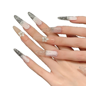 Pink cat-eye stiletto press-on nails with silver glitter and 3D floral accents