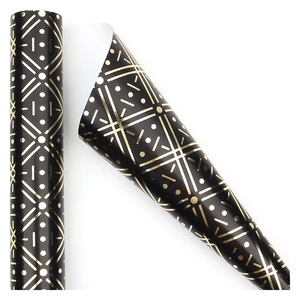 Matte black gift wrapping paper with gold geometric patterns in roll and sheet view
