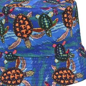 Close-up of vibrant sea turtle prints on a deep blue bucket hat with quality stitching