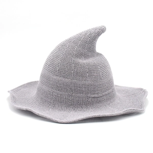 Light gray knitted witch hat with pointed tip and wavy wide brim for Halloween