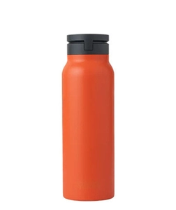Close-up of matte orange stainless steel water bottle with black magnetic lid detail