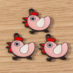 Three cute pink enamel cartoon hen charms with hanging loops on wood background