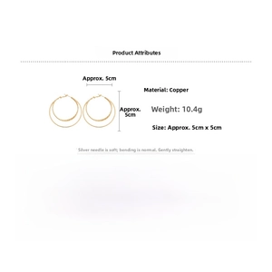 Macro shot of 18k gold plated triple layered round hoop earrings with silver pins