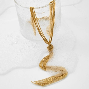 Exaggerated golden multi-layer chunky knot chain necklace with polished fringe detail
