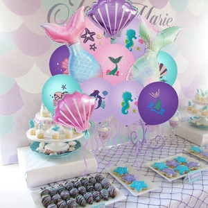 Mermaid party decoration set with gradient foil tails and shell balloons on dessert table