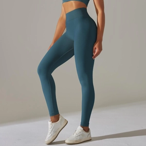 Close-up of seamless dark teal yoga leggings highlighting high waist and butt lift fit