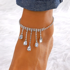 Close-up of bohemian rhinestone ankle bracelet with dangling crystal teardrop pendants