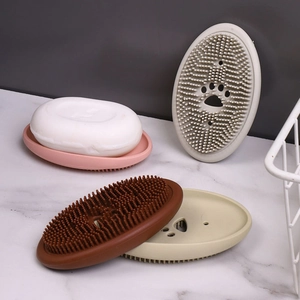 Silicone soap dish with soft cleaning bristles and cute paw-shaped drainage holes