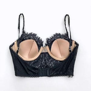 Detail of black eyelash lace bralette with beige cups and adjustable back closure