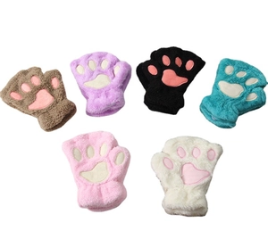 Flat lay of colorful plush cat paw fingerless knit gloves in various pastel shades