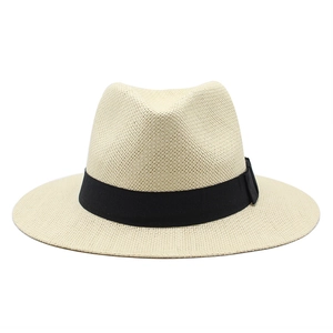 Close-up of the dense woven texture and black ribbon on a cream straw panama hat