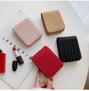 Mini makeup pouch with mirror and vertical pleat texture in pink, khaki, black and red