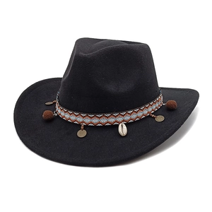Detail of western wool fedora with bohemian woven band, shells and ethnic charms