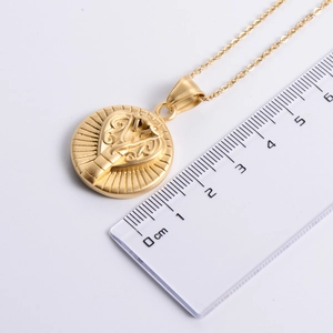 Golden matte cobra totem pendant with thin chain shown with scale for size measurement