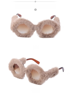 Detailed view of round sunglasses with golden frame, yellow lens and plush trim