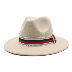 Detailed view of beige wool fedora hat featuring red and blue geometric patterned band