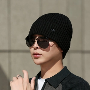 Black ribbed knit beanie for men with thermal fleece lining and silver mountain metal logo