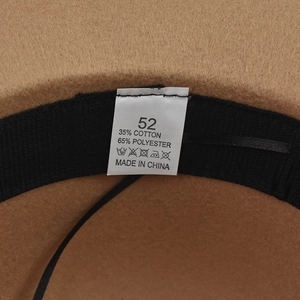 Detail view of the brown wool hat interior showing sweatband and size 52 fabric label