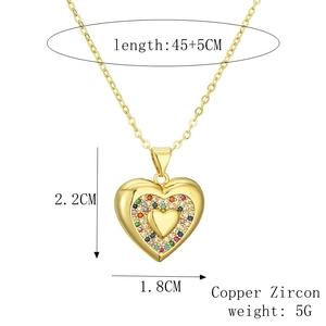 Detailed view of heart necklace with colorful zircon inlay and copper finish details