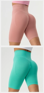 Detail of seamless high waist and scrunch butt design on pink and turquoise yoga shorts