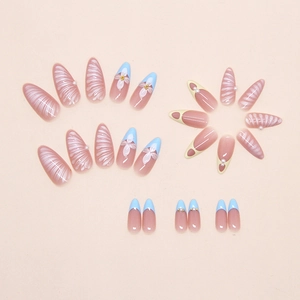 Detail of almond-shaped blue french press-on nails with 3D pearls and shell textures