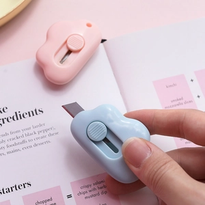 Mini cloud-shaped utility knives in pink and blue for unboxing and stationery use