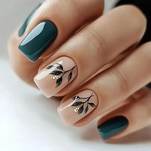 Glossy square-oval press-on nails with dark green color and hand-painted leaf patterns