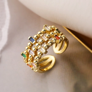 Gold multi-layer beaded ring featuring colorful rectangular gemstones in open design