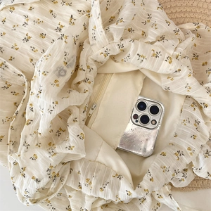 Close-up of internal zipper pocket showing large capacity for smartphone in floral tote bag