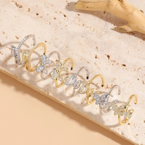 Collection of geometric butterfly open rings with cubic zirconia in gold and silver plating