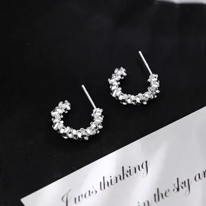 Minimalist S999 sterling silver C-shape stud earrings with textured silver nugget finish