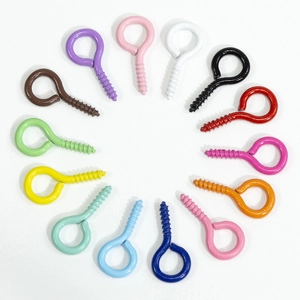 Colorful painted metal screw eye pins in various vibrant colors arranged in a circle