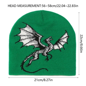 Size guide showing dimensions of the green knitted dinosaur beanie 22cm by 21cm