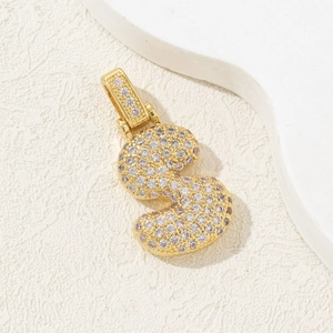 Close-up of gold-plated number 3 pendant with sparkling cubic zirconia micro-pave setting
